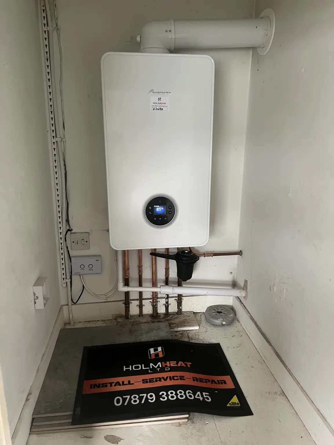Combi boiler installed in a utility space