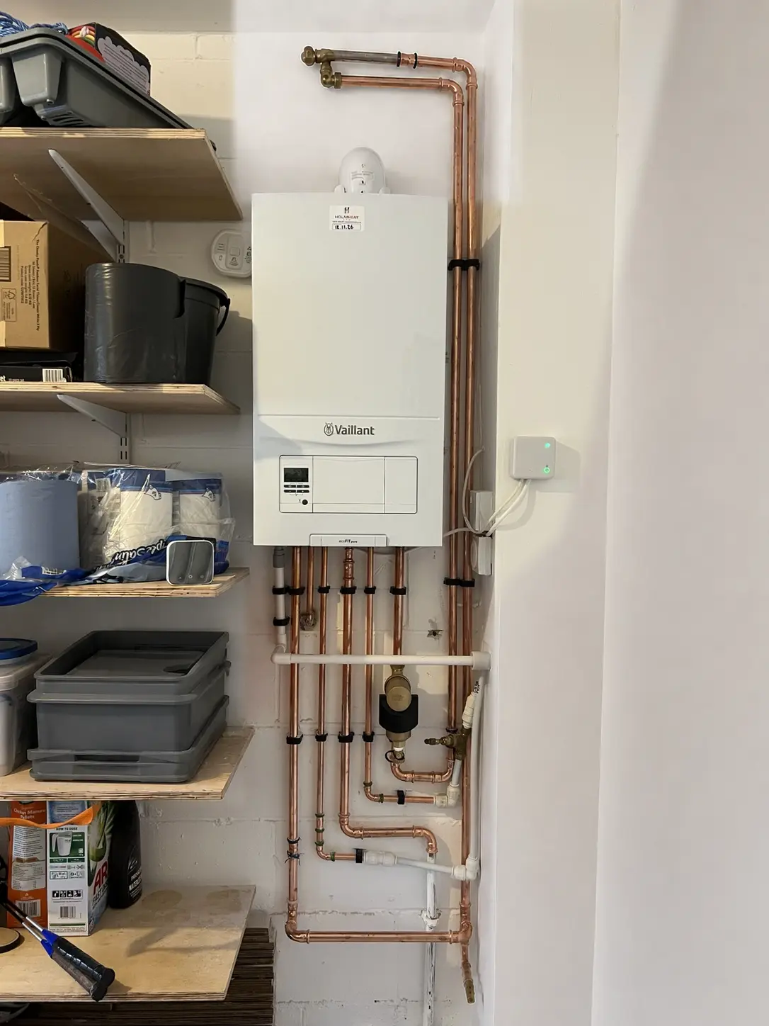 Vaillant boiler installation with neatly routed copper pipework by HOLMHEAT